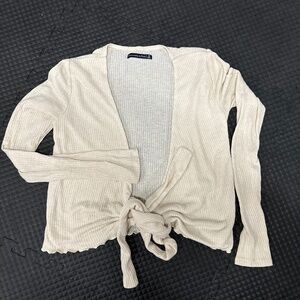 Cream colored wrap sweater. Great condition.